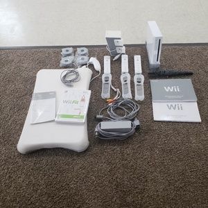 Wii Console with Balance Board and Wii Fit game.